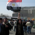An Egyptian girl waving the Egyptian flag